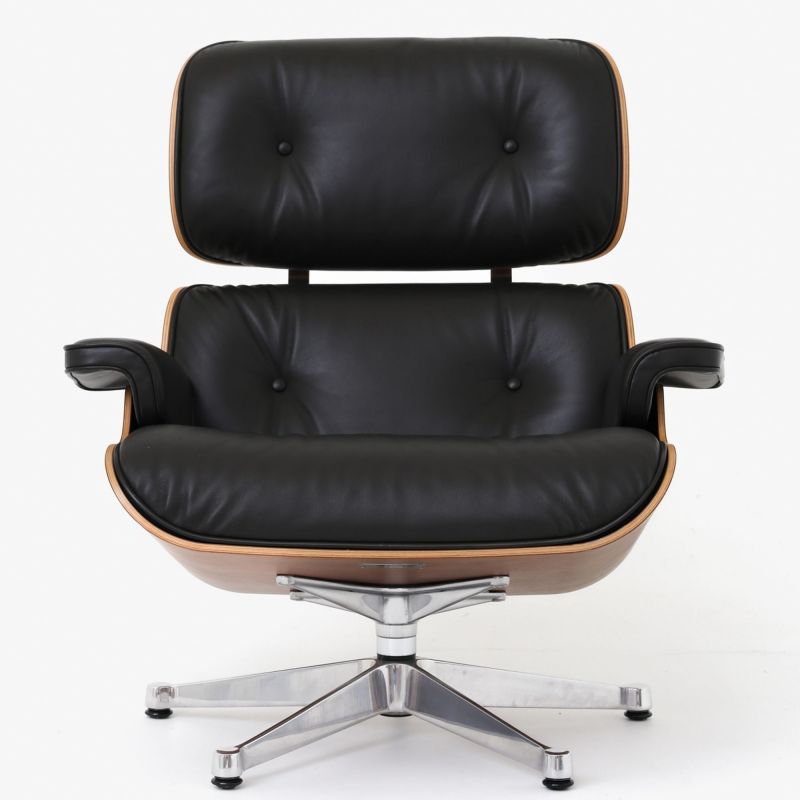 Lounge chair and matching stool in walnut