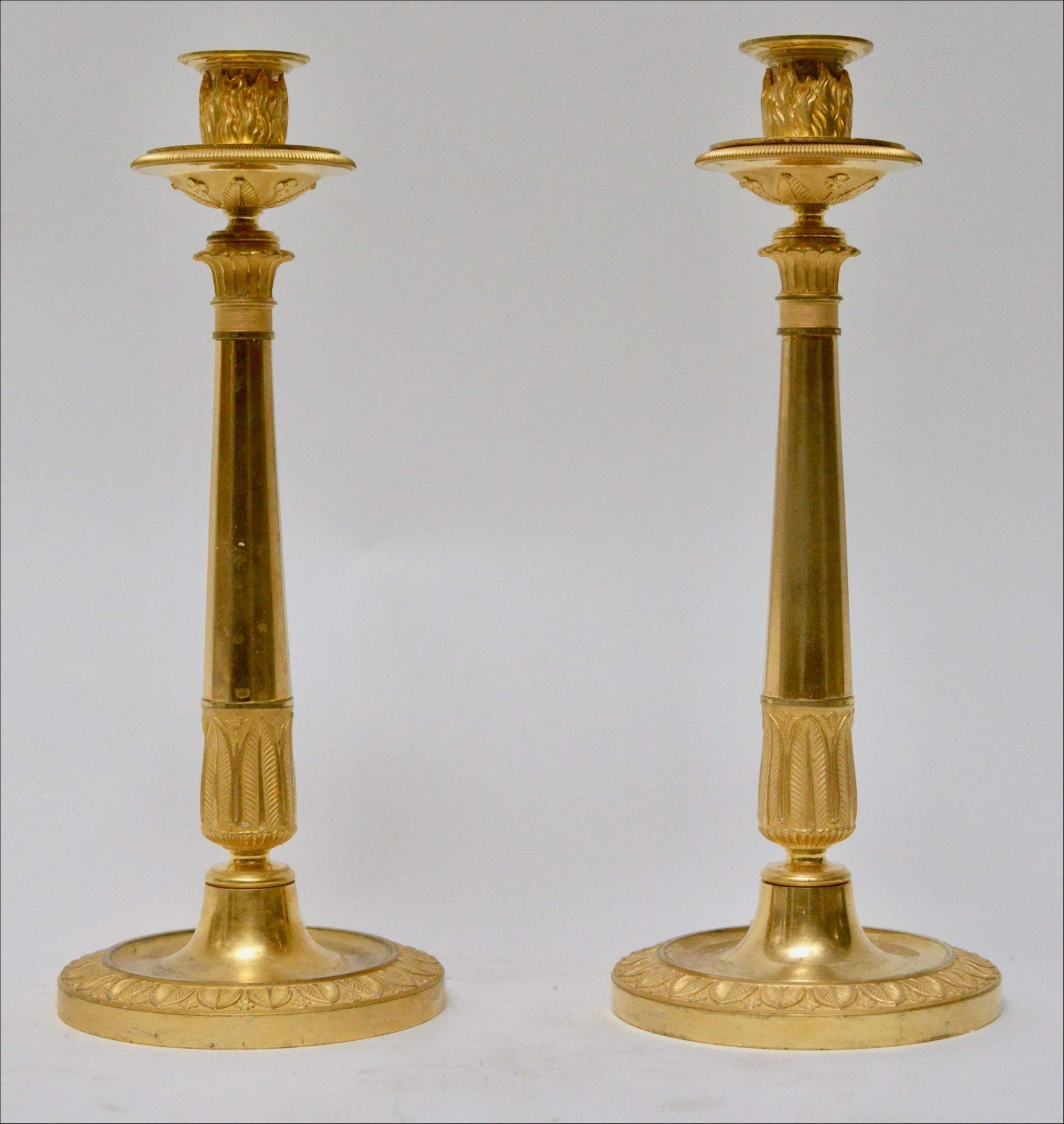 A Pair of French Empire Gilt Bronze Candlesticks. ca.1810